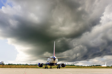 Airplane under a thuderstorm
