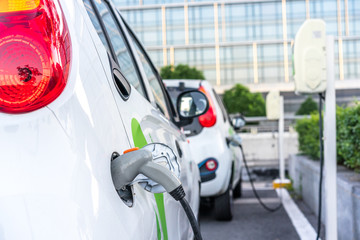 Fototapeta premium electric car charging in the station