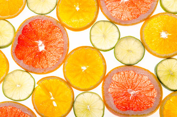 slices of citrus fruits on white background