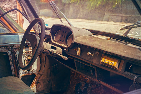 old abandoned car interior covered with dust