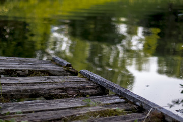 rotten, old bridge on the lake for a background