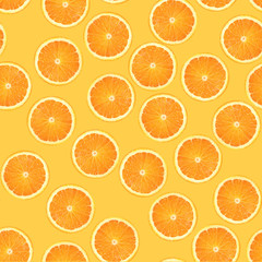 fruit pattern of fresh orange slices on orange background. From top view