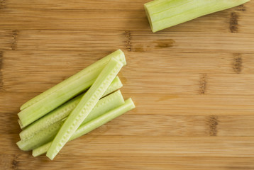 Sliced cucumber on wooden board