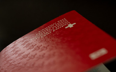swiss passport close up on black background switzerland citizenship