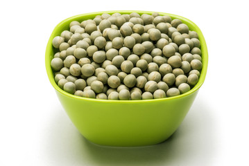 Green peas in bowl isolated on white background