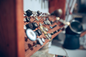 Different goldsmiths tools on the jewelry workplace. work in jewelry.