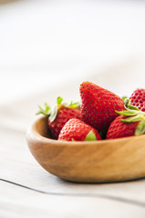 Fresh strawberries close up on wooden background