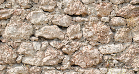 orange wall of a wild stone close up