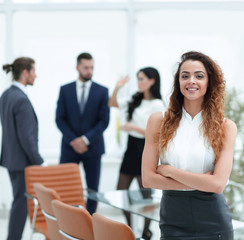 beautiful woman on the background of business people.