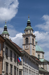 Fototapeta na wymiar Slovenia, 24/06/2018: lo skyline del centro di Lubiana con vista del campanile della cattedrale, la chiesa di San Nicola, ex chiesa gotica sostituita nel XVIII secolo da un edificio barocco