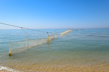 Fishing nets set in the sea. Fishing nets.