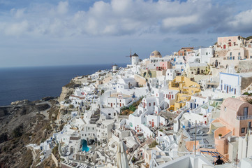 Whitewashed Houses and Windmill on Cliffs with Sea View in Oia, Santorini, Cyclades, Greece