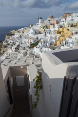 Whitewashed Houses and Windmill on Cliffs with Sea View in Oia, Santorini, Cyclades, Greece