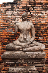 Fototapeta premium Ruined Buddha sculpture of Wat Chai Watthanaram, Ayutthaya, Thailand