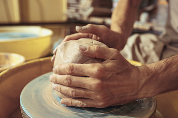 Creating a jar or vase of white clay close-up. Master crock.