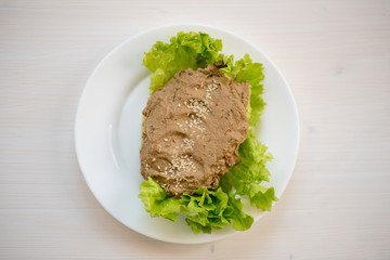 photo of a natural meal on a light background on a white plate.