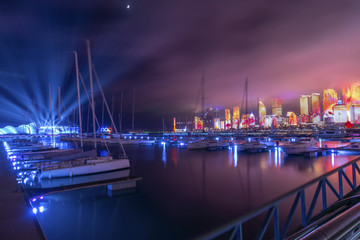 Obraz na płótnie Canvas Qingdao Bay yacht wharf and urban architectural landscape