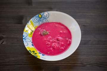 photo of a real meal on a dark background on a white plate.