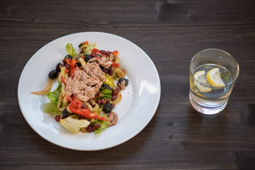 photo of a real meal on a dark background on a white plate.