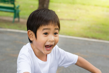 Portrait of boy surprised on nature background