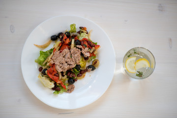 photo of a natural meal on a light background on a white plate.