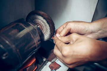 Different goldsmiths tools on the jewelry workplace. Jeweler at work in jewelry.