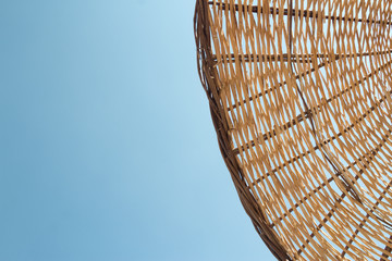 Straw umbrella closeup texture in the daylight