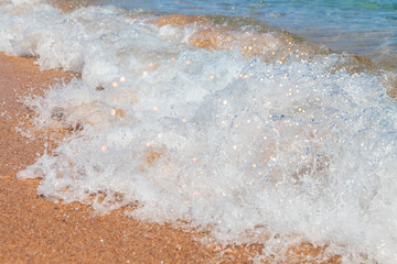 Sea wave, running on the sandy shore