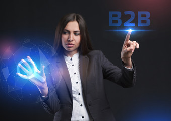 The concept of business, technology, the Internet and the network. A young entrepreneur working on a virtual screen of the future and sees the inscription: B2B