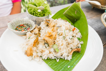 fried rice with crispy fish in white dish for healthy meal,selective focus.