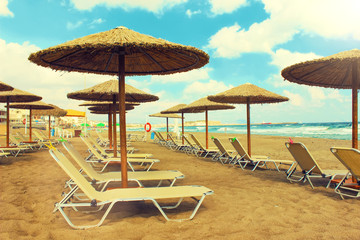 Umbrellas and chaise lounges on the southern beach