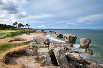 Bunker ruins near the Baltic Sea beach, part of the old fortress in the former Soviet Union base "Karosta" in Liepaja, Latvia. Photographed in summer.