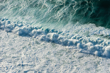 Diagonal rapid splash - aerial view on large coastal waves