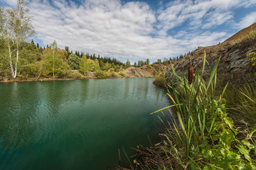 Blue lake in Altai. This is a former copper mine that was flooded with water