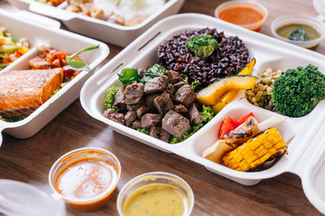 Clean food meal box: Diced grilled beef served with rice berry, broccoli, bean sprout, corn, mushroom and tomato.