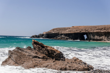 ocean landscape with arch of srone. Fuerteventura.