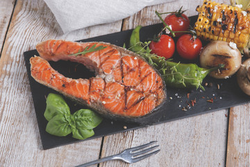 steak grilled salmon with vegetables