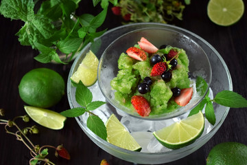 Green granita with matcha tea, lime and mint topped with fresh berries