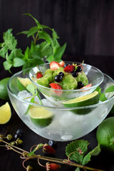 Green granita with matcha tea, lime and mint topped with fresh berries