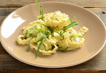 Italian pasta noodles with zucchini, arugula, basil
