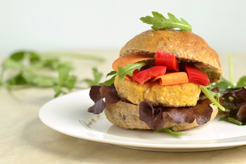 Vegetarian bean burgers with vegetables, served with sauce