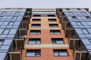 Creative and modern architectural design in the city, new multistorey apartment block. © kyrychukvitaliy