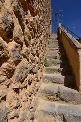 Fototapeta premium Climbing Stairs To The Beautiful Walls In The Walled City Of Segovia. Architecture History Travel. June 18, 2018. Segovia Castilla-Leon Spain.