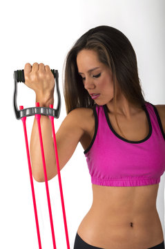 Fitness woman with elastic rope