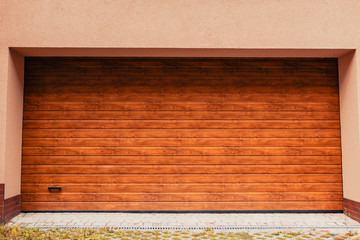 Wooden garage door. Modern garage in new building