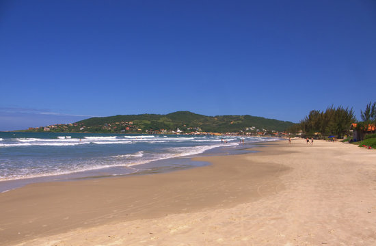 The beautiful beach at the small coastal town of Garopaba on a perfect sunny day. © steve