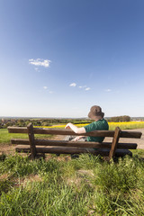 resting hiker on a bench