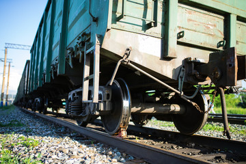 Naklejka premium railroad cars loaded with coal, the train transports coal. loading of wagons with coal. night views.