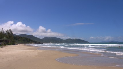 The beautiful beach at the small coastal town of Garopaba on a perfect sunny day.