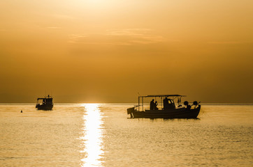 Fishing boat on the high seas, in the early morning hours in Leptokarya, Greece 